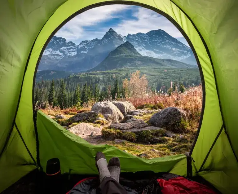 View from tent to the Tatras at sunset in autumn.