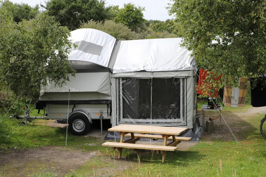 Popup camper with an awning room.