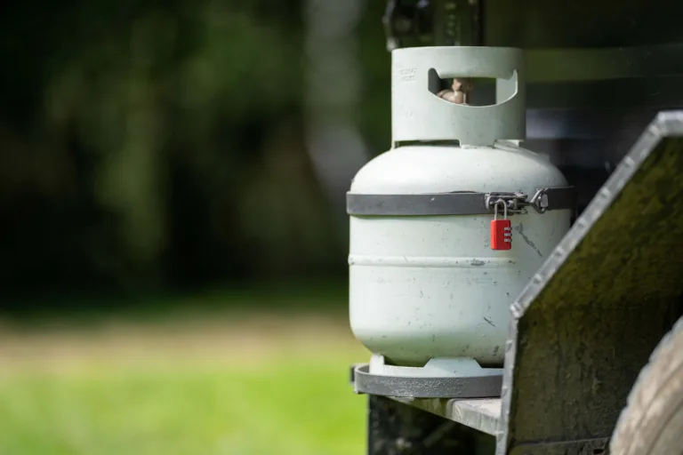 Propane tank on back of camper.