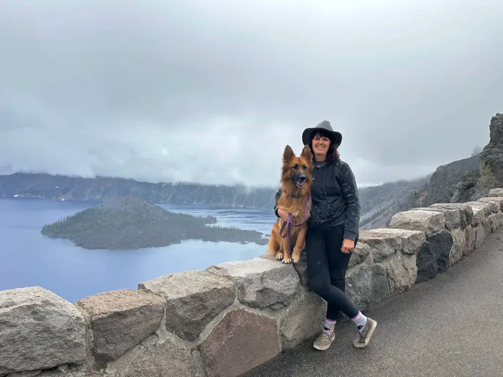 Woman and German Shepherd dog at Crater Lake.