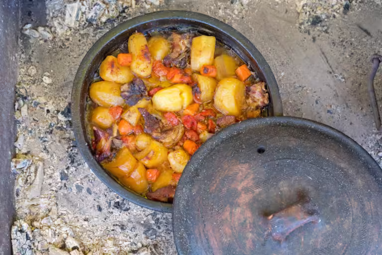 Slow Cooking in Dutch Oven at Coals Fire