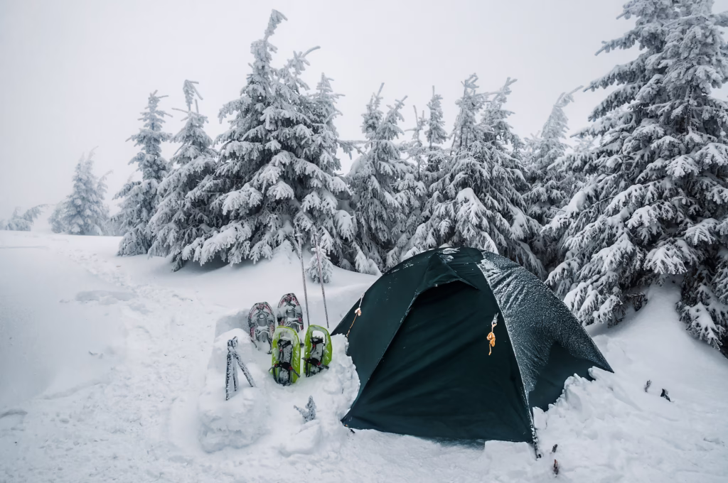Tent on the snow in winter Carpathian mountains.