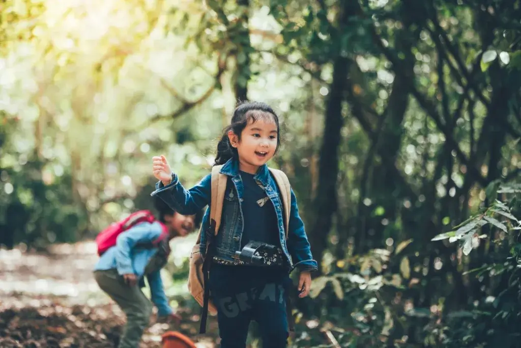 Children hiking on a scavenger hunt.
