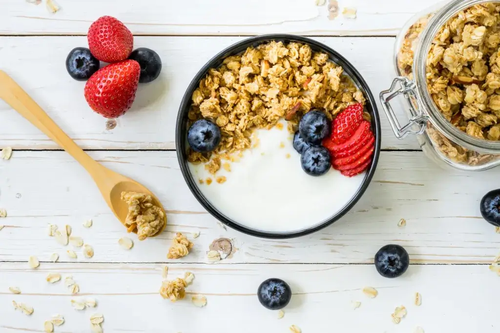 Greek yogurt with granola and fruit.