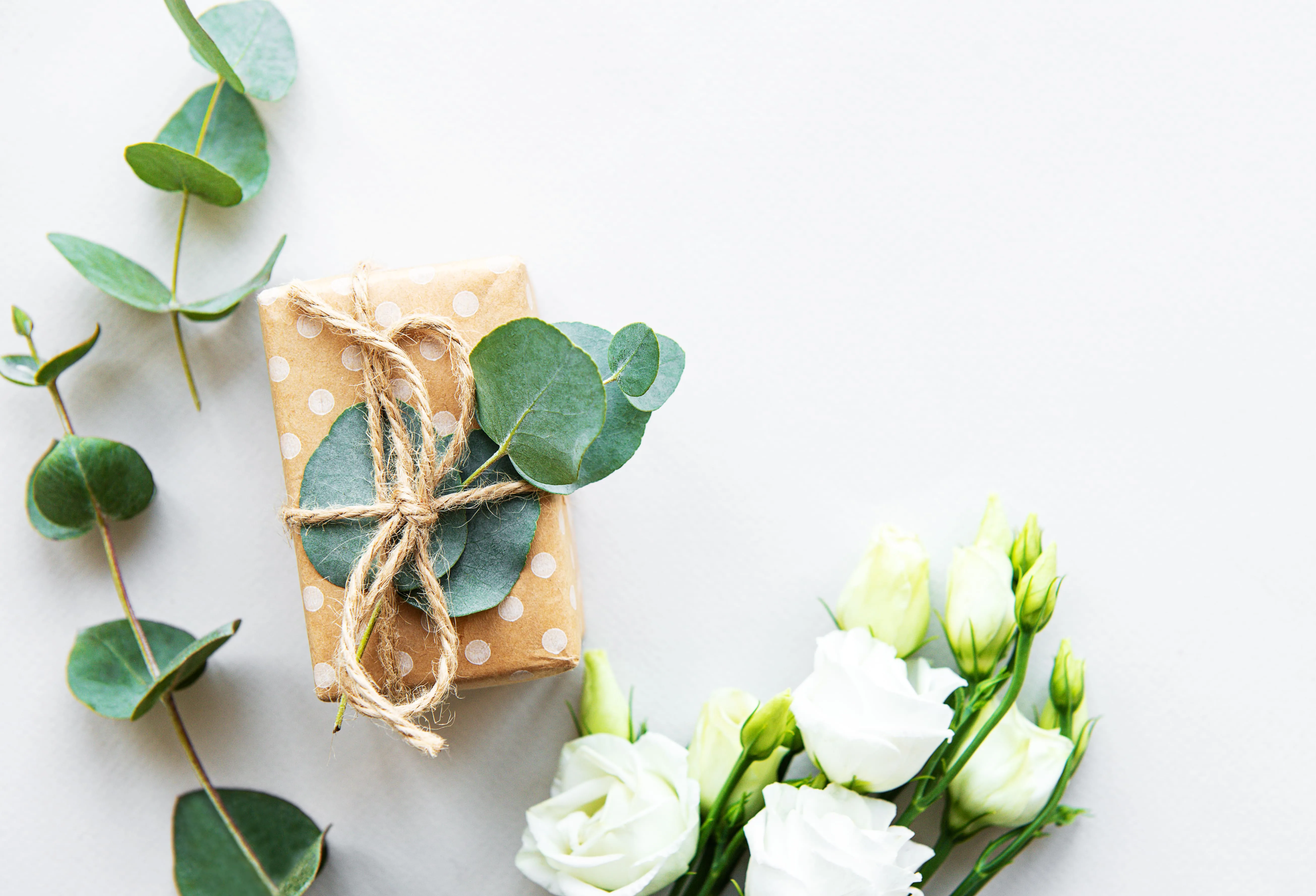 White eustoma flowers and gift box