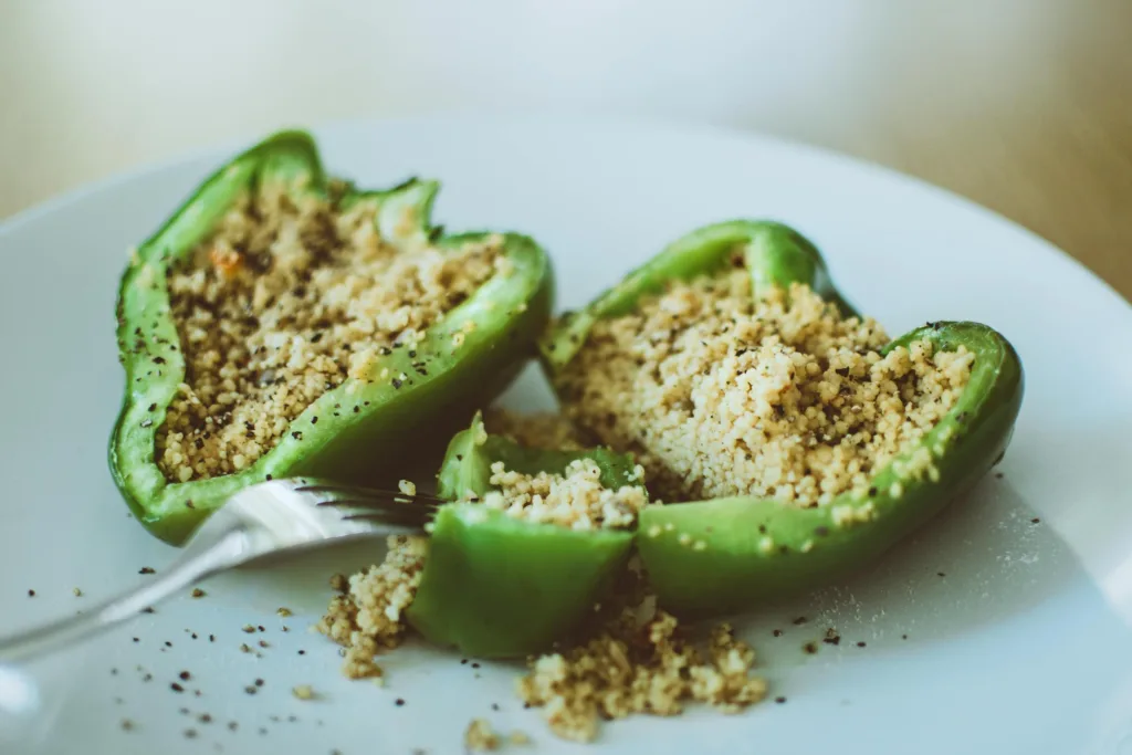 Delicious stuffed green bell pepper with couscous, perfect for a healthy vegetarian meal.