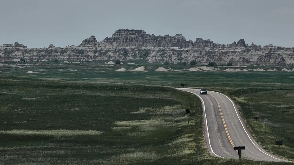 A tranquil drive through the vast landscapes of Badlands National Park, South Dakota.